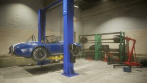Magic Media Game Design, a blue classic car is lifted in a garage with tools and tires in the background.